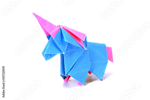 Cute Unicorn origami paper art isolated on white background. Ideas for DIY hobby (Do It Yourself) for Children. 