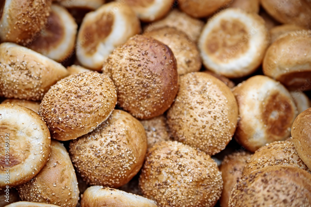The soft toasted buns are in a box at the grocery store. The soft toasted buns are in a box at the grocery store.