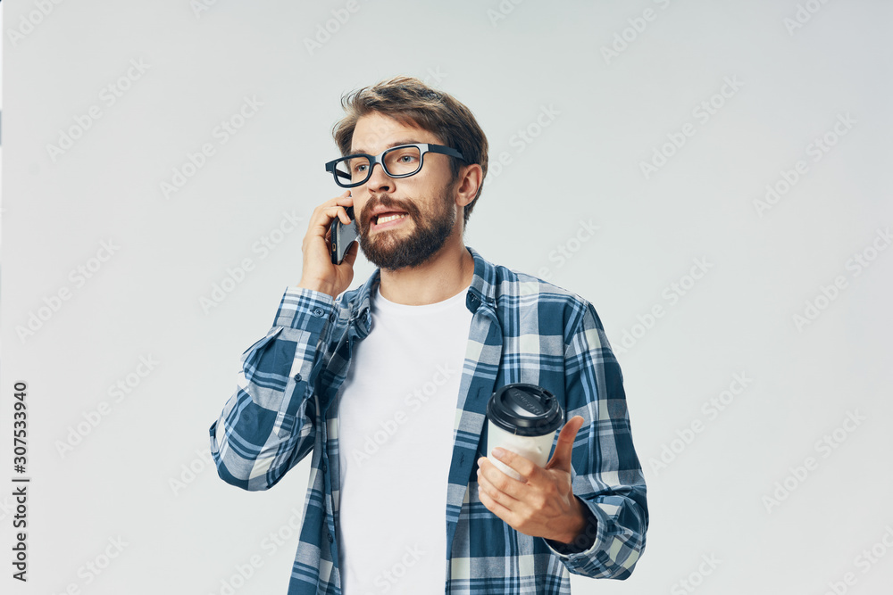young man talking on the phone isolated on white young man talking on the phone isolated on white