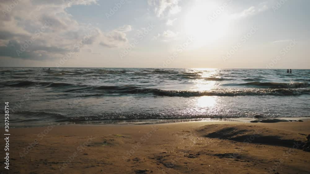 Amazing sunset and beautiful waves on the sea, summer vacation concept. Amazing sunset and beautiful waves on the sea, summer vacation concept.