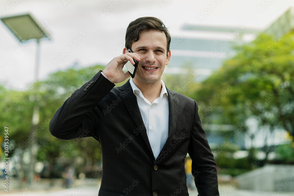 Expression Face Businessman Talking On Mobile Phone Call standing in front building Expression Face Businessman Talking On Mobile Phone Call standing in front building