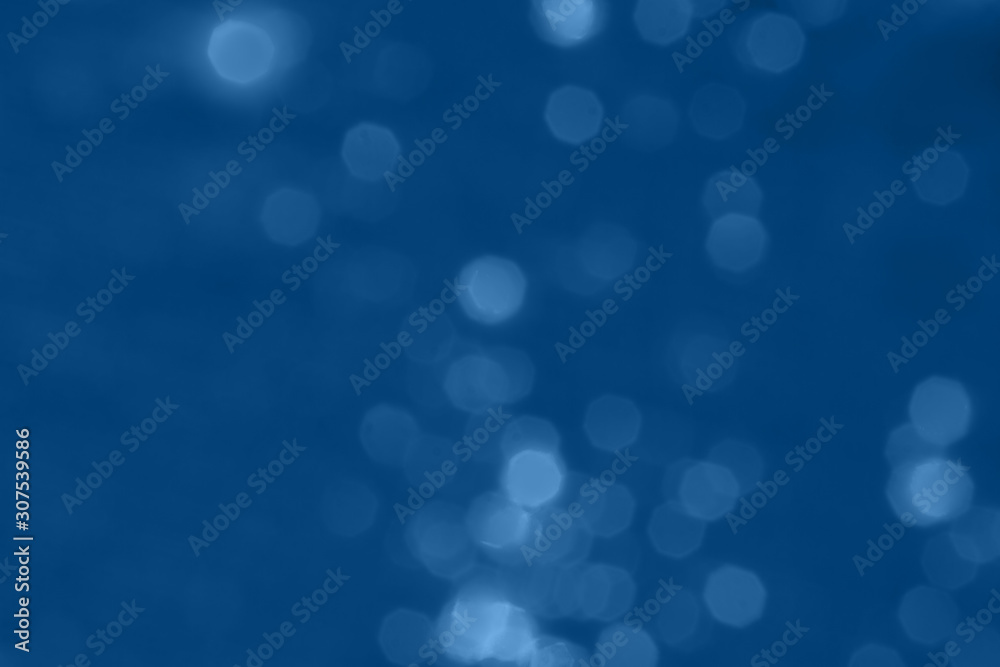 Abstract blurred dark blue background with beautiful bokeh effect.