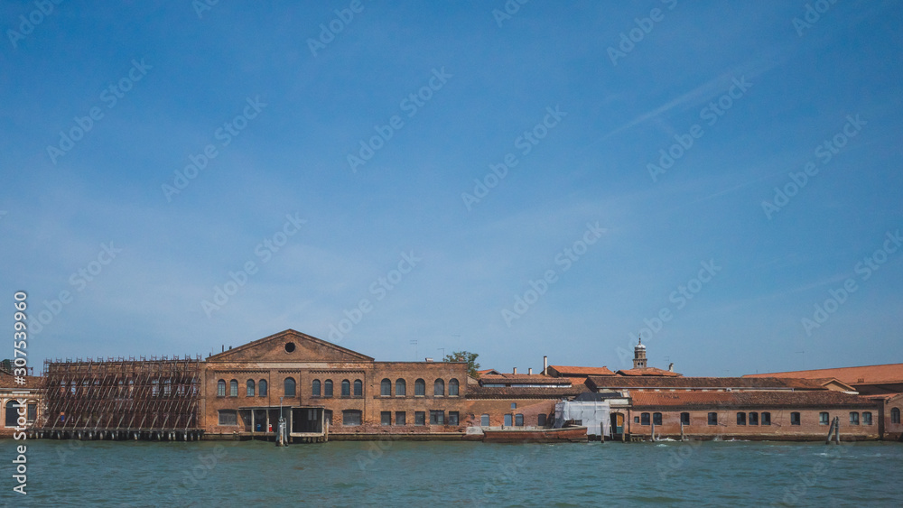 Glass furnaces of island of Murano by water, Venice, Italy