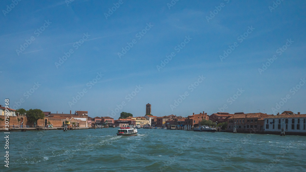 Buildings of Murano by water, in Venice, Italy