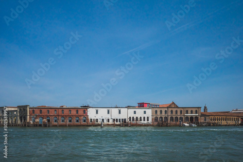 Glass furnaces of island of Murano by water, Venice, Italy