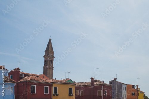 Tower over colourful houses of island of Burano, Venice, Italy