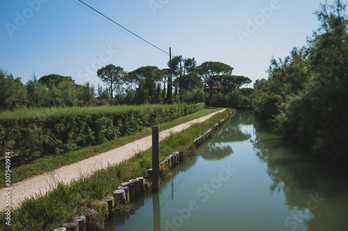 Path by river on island of Torcello, Venice, Italy © Mark Zhu