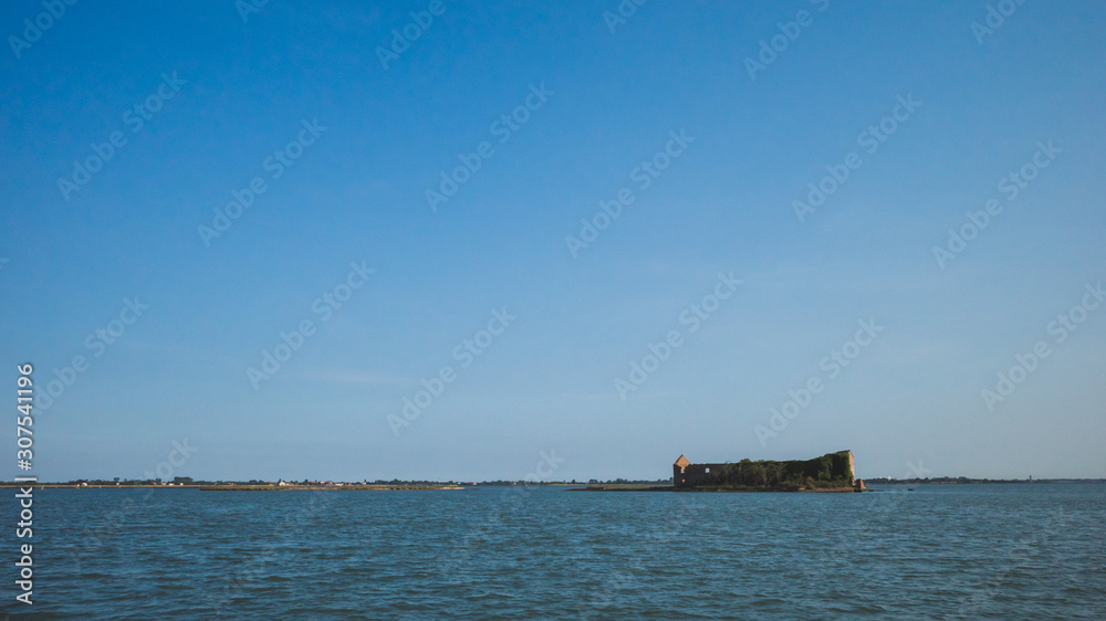 Building ruins on island in lagoon, Venice, Italy Building ruins on island in lagoon, Venice, Italy