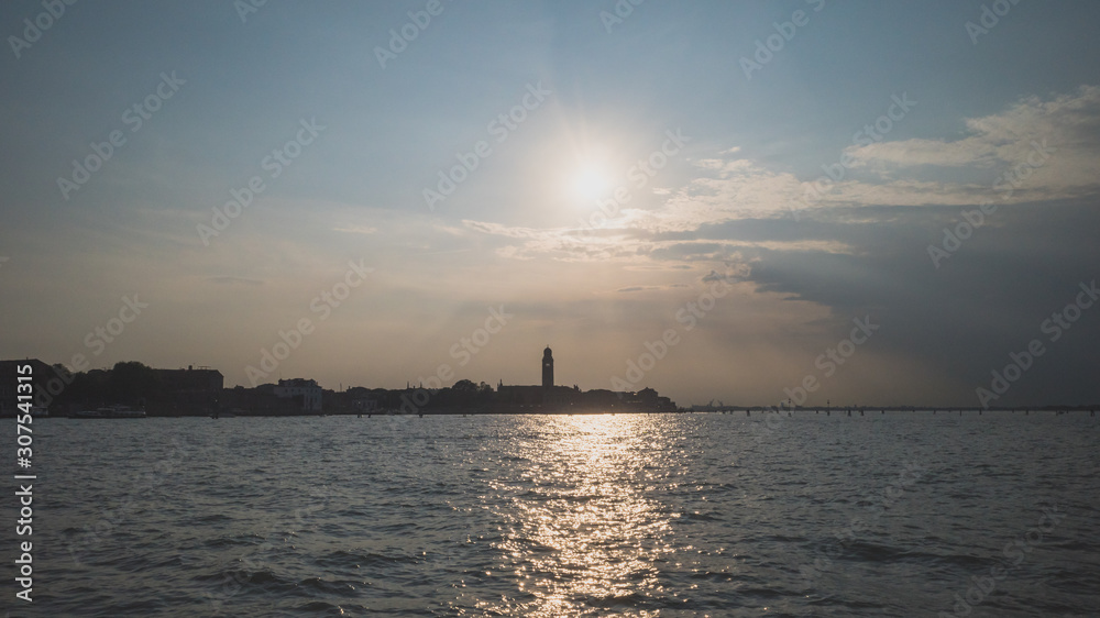 Island of Venice over water at sunset, Venice, Italy Island of Venice over water at sunset, Venice, Italy