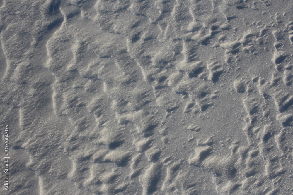uneven surface of snow cover in winter in nature in the Siberian field uneven surface of snow cover in winter in nature in the Siberian field