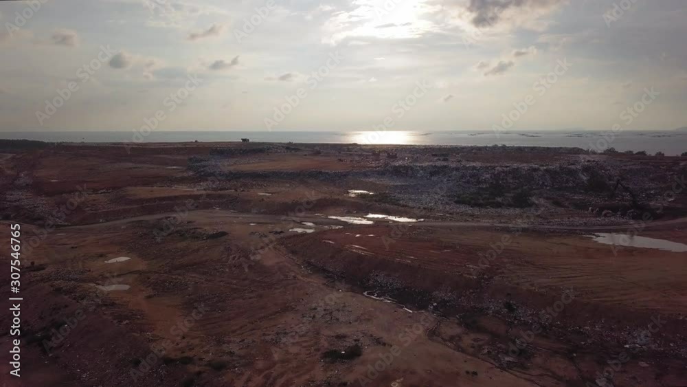 Aerial fly towards landfill site. Pollution concept garbage pile in trash dump. Aerial fly towards landfill site. Pollution concept garbage pile in trash dump.