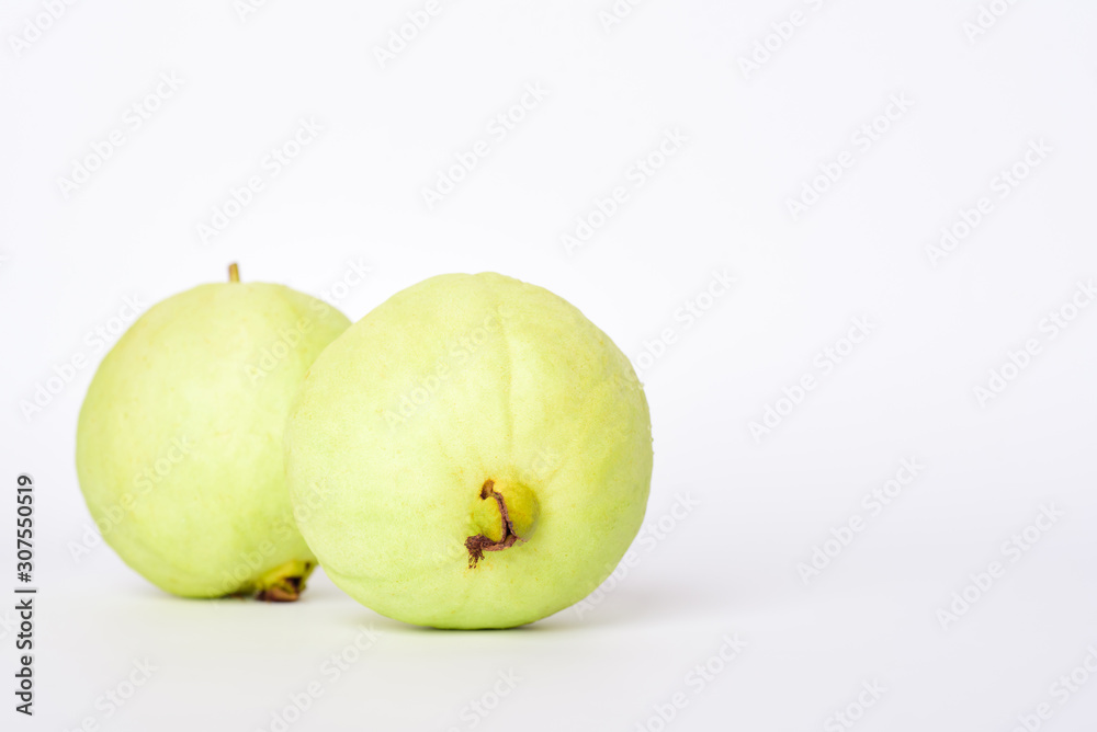 Fresh organic guava tropical fruit on white background. Healthy food high vitamin C concept. Fresh organic guava tropical fruit on white background. Healthy food high vitamin C concept.