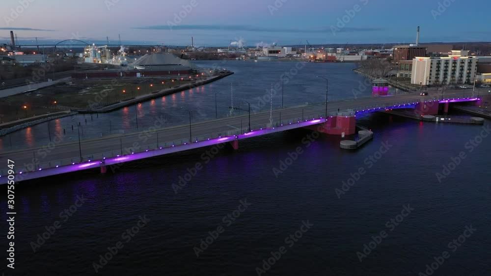 Sunset on Bridge over River with Purple Lights (drone video) Sunset on Bridge over River with Purple Lights (drone video)