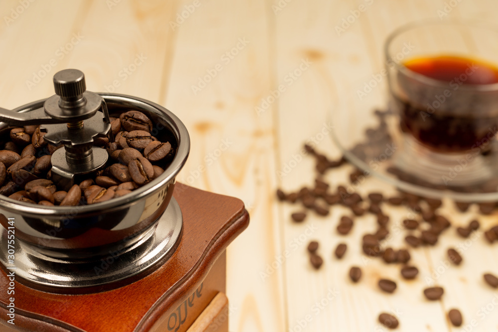 cup of coffee with beans and grinder cup of coffee with beans and grinder