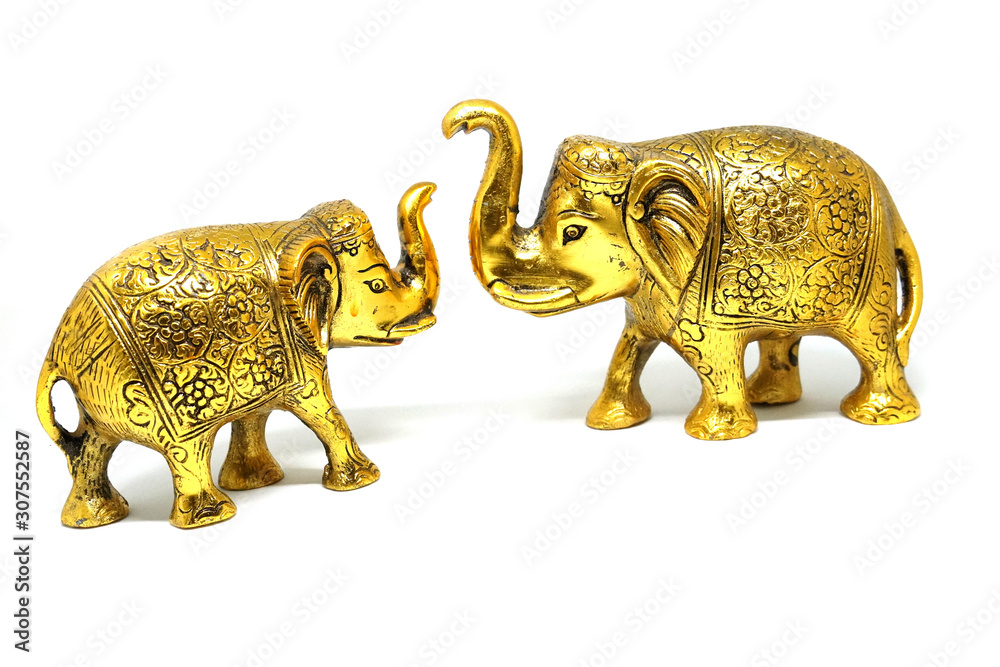 Golden Colored Elephant Toy Art, Elephant couple on isolated white background. Golden Colored Elephant Toy Art, Elephant couple on isolated white background.