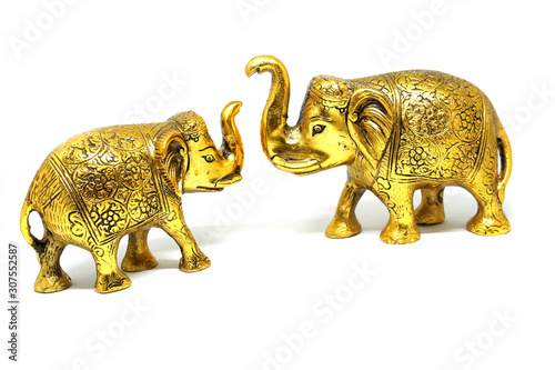 Golden Colored Elephant Toy Art, Elephant couple on isolated white background.