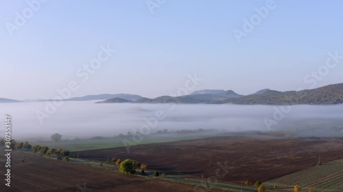 Foggy landscape drone shot over the Kali-basin. photo