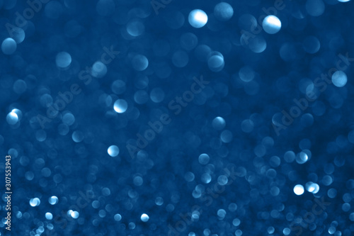 Blue defocused glitter backround.