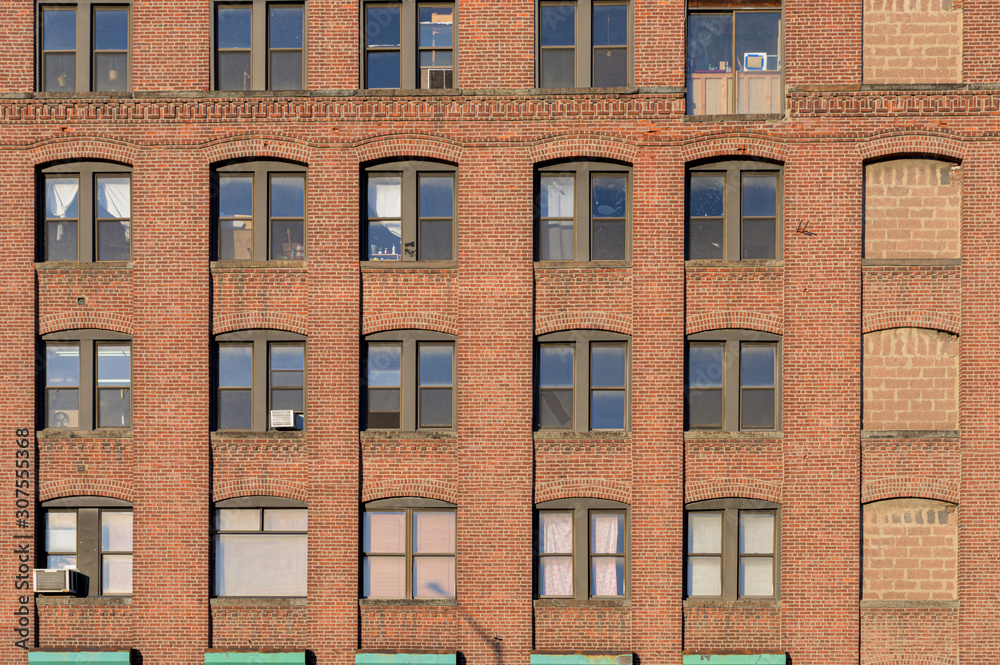 Close-up of the facade of an old-fashioned brickwall factory building in the Bronx, New York