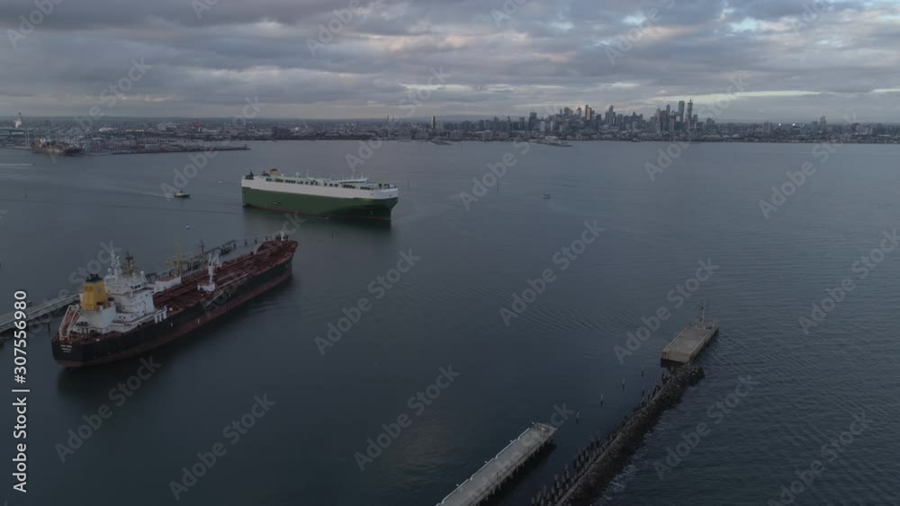 Docks and cargo ship with city skyline background Melbourne Docks and cargo ship with city skyline background Melbourne
