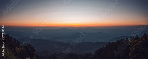 landscape mountains forests sky in the evening