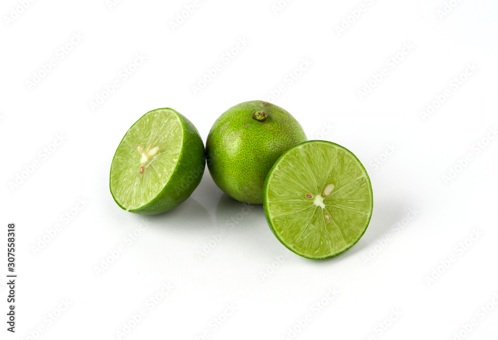 Fresh lime with half and leaves on white background, green lemon