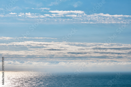 Clouds above a calm sea