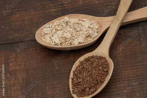 Seeds on a wooden spoon close up