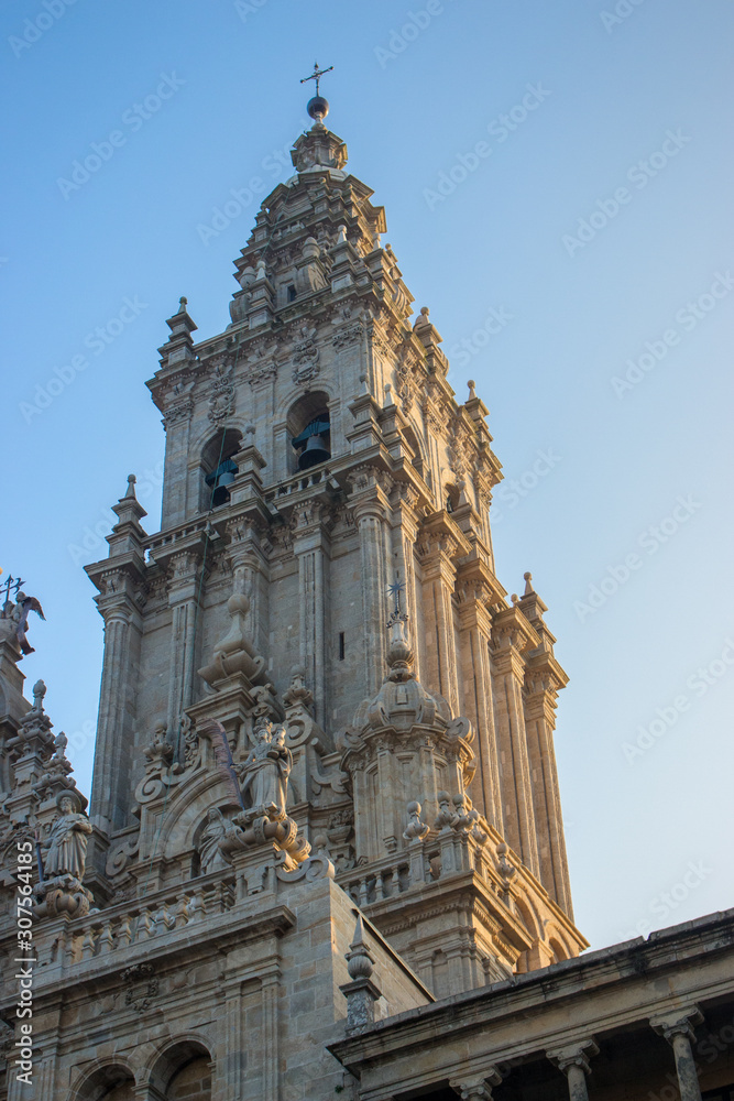 Famous Cathedral of Saint James in Santiago de Compostela, Spain. Catholic church in the morning light on blue sky background. Pilgrimage centre. Religious heritage. Medieval architecture.