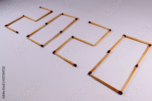 letter 2020 with matches in white background