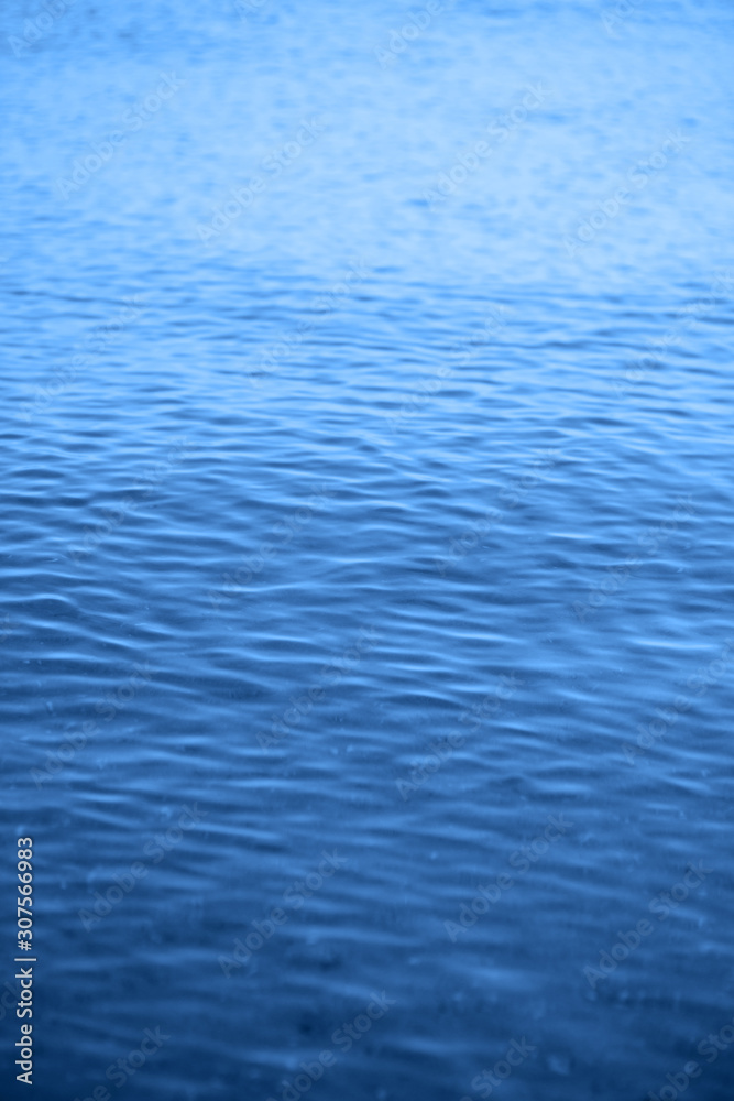 Blue ripple water wave on sand in sea ocean for background Blue ripple water wave on sand in sea ocean for background