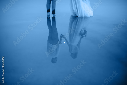 Blurred Romantic couple son the beach and enjoying beautiful sea view photo