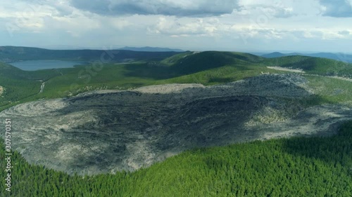 Aerial drone shot of the Obsidian Flow Crater in Sunriver Oregon in the shadow of Paulina Peak photo