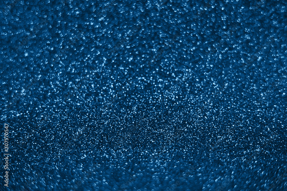 Bright sparkle blue background. Holiday and festive concept. New year, Christmas, Wedding Day, Birthday.
