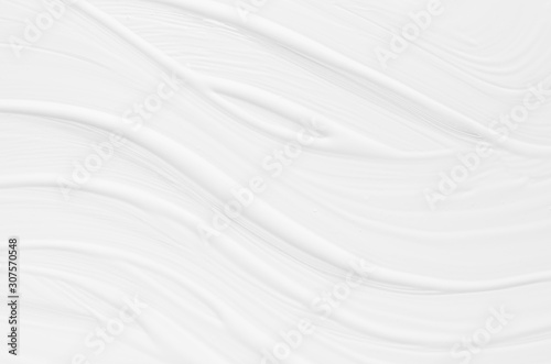 Soft light white fluid paint background with diagonal waves brush strokes as abstract texture.