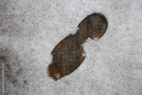 Footprint on white snow,  first snow. Aerial view