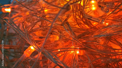 Christmas video, glowing garlands, festive background. Happy holiday celebration. Merry christmas and Happy New Year. Colorful backdrop. Festive background.