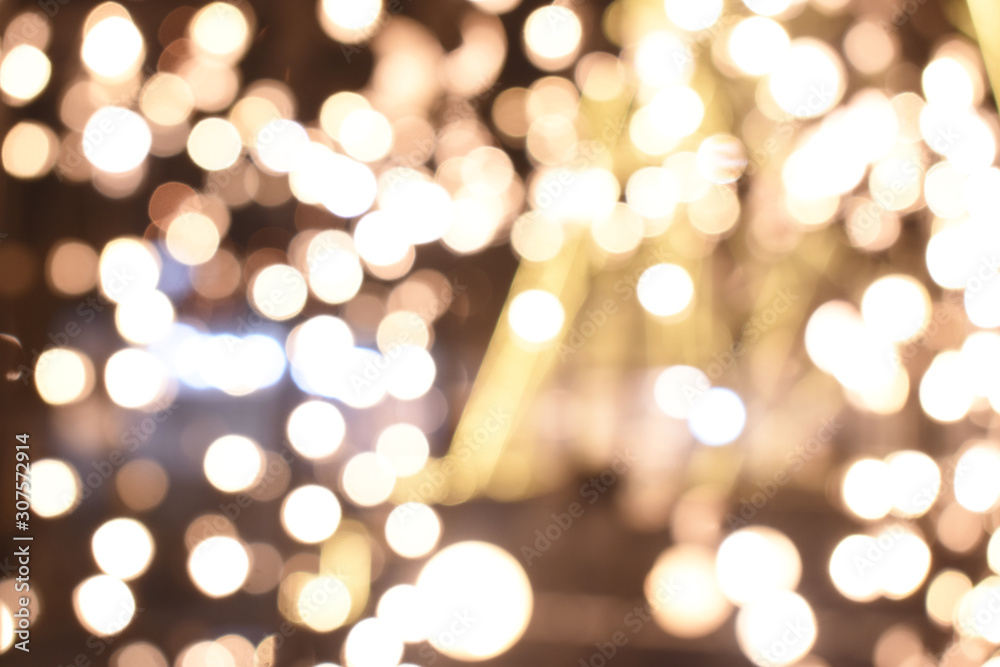 Fototapeta premium shiny light from electric bulb in the dark night, bokeh background