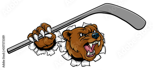 A bear ice hockey player animal sports mascot holding a hockey stick