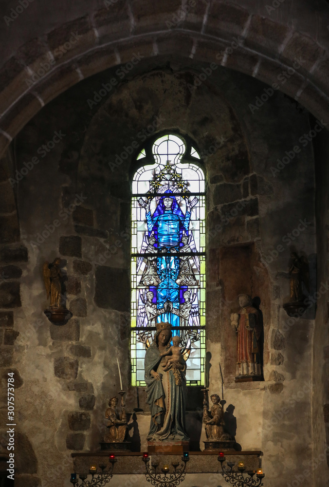 Stained glass in Saint Pierre parish church. Mont Saint Michel, France
