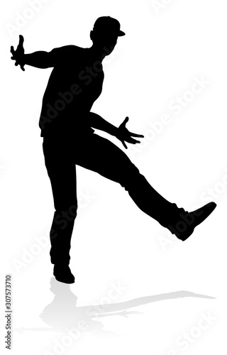 A male street dance hip hop dancer in silhouette