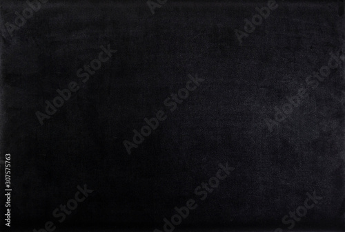 Black color velvet texture. Dark background. Top view. photo