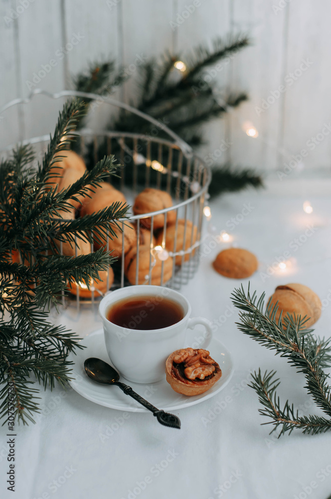 Nuts for tea with condensed milk on a wooden table. Winter. Christmas Nuts for tea with condensed milk on a wooden table. Winter. Christmas