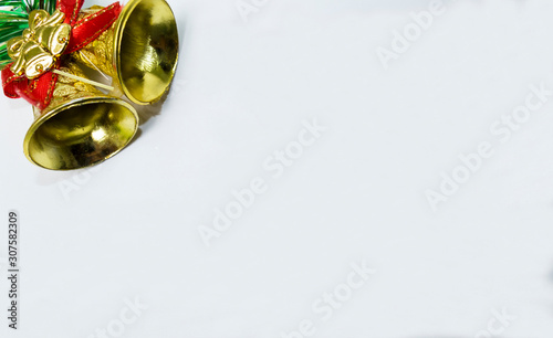 Golden bells with red ribbon for Christmas background