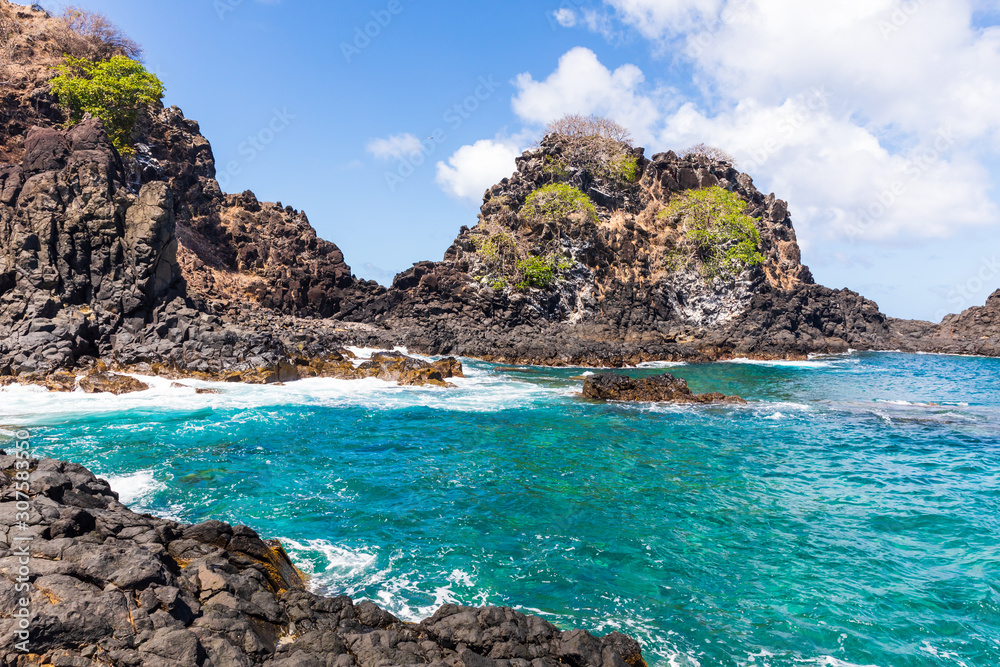 Beautiful view of Baia do Sancho in Fernando de Noronha, Brazil. This part of the bay can only be accessed after walking about 200 meters over volcanic rocks.