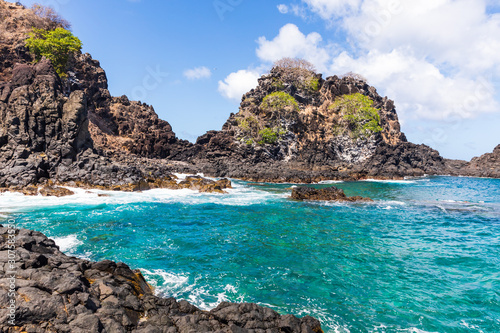 Beautiful view of Baia do Sancho in Fernando de Noronha, Brazil. This part of the bay can only be accessed after walking about 200 meters over volcanic rocks.