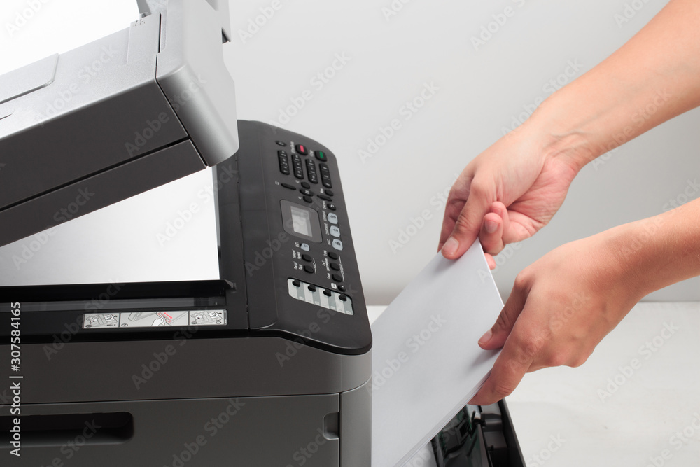 Hand press button on panel of printer. printer scanner laser office copy machine supplies start concept - Image Hand press button on panel of printer. printer scanner laser office copy machine supplies start concept - Image