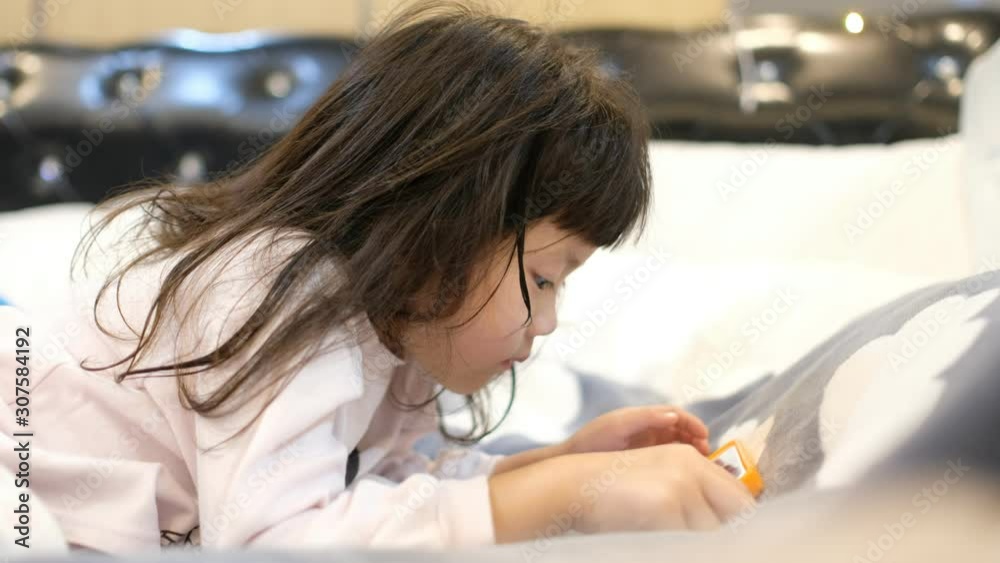 chinese child addicted phone, asian girl playing smartphone, kid use telephone, watching cartoon chinese child addicted phone, asian girl playing smartphone, kid use telephone, watching cartoon