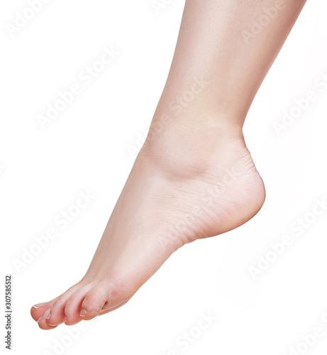 Bare female foot closeup. Isolated on white background. © Galaxy_love_design