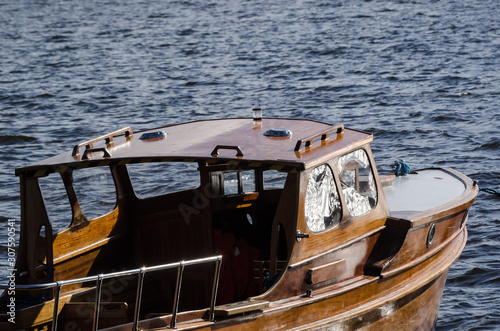 MOTORBAT - Beautiful classic wooden boat on the lake photo
